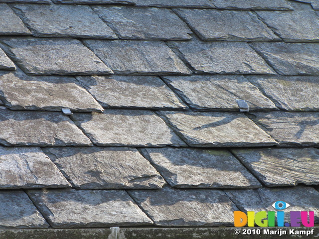 SX12427 Sun on slate roof of farm building